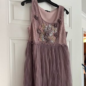 Mauve colored empire tulle dress with blue, green, lavender flowers.